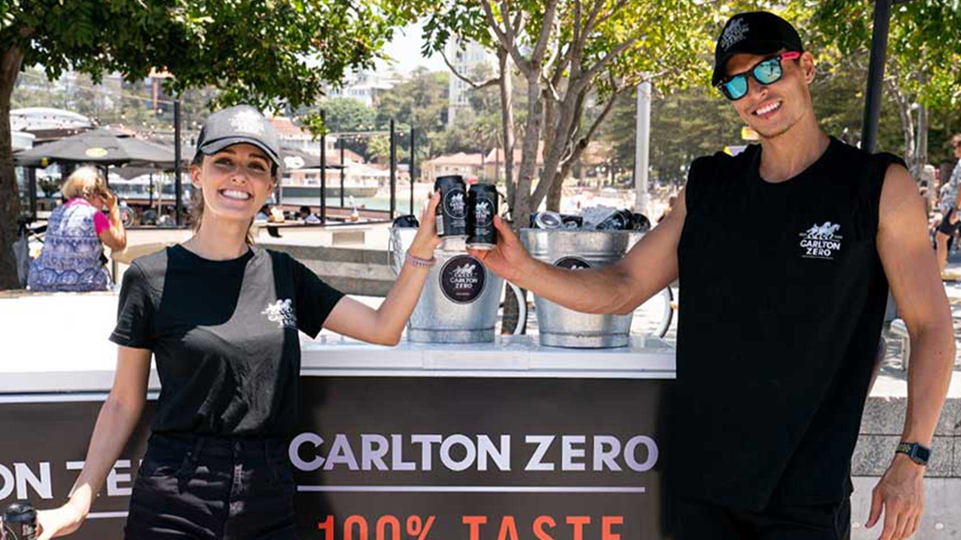 two people standing in front of coffee cart